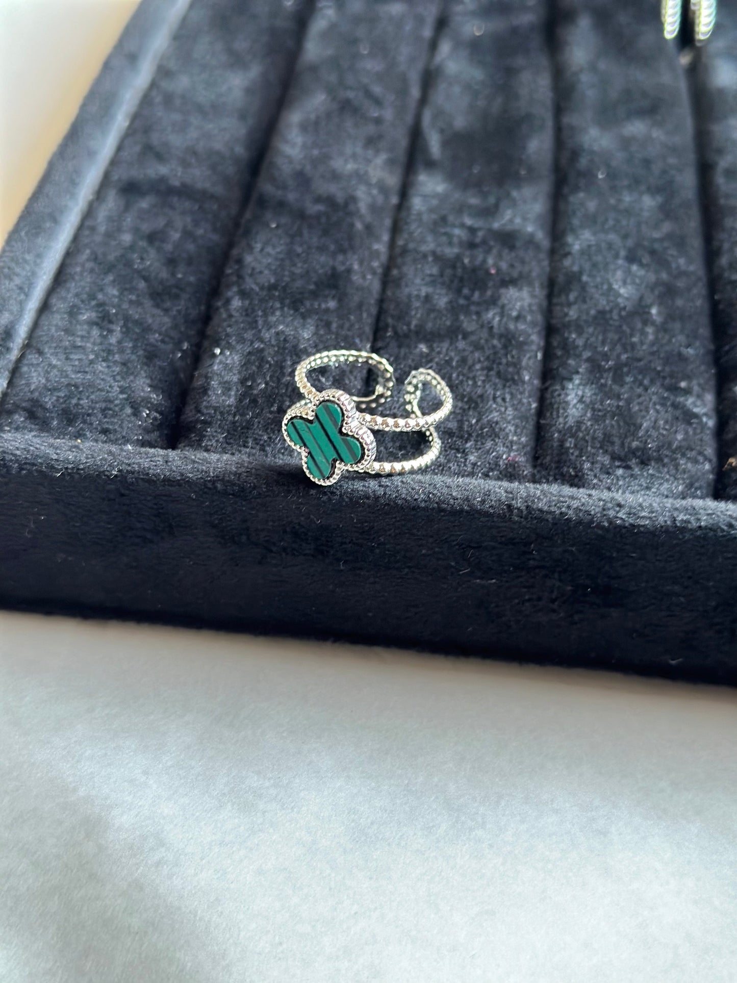 Silver colored vancleef ring