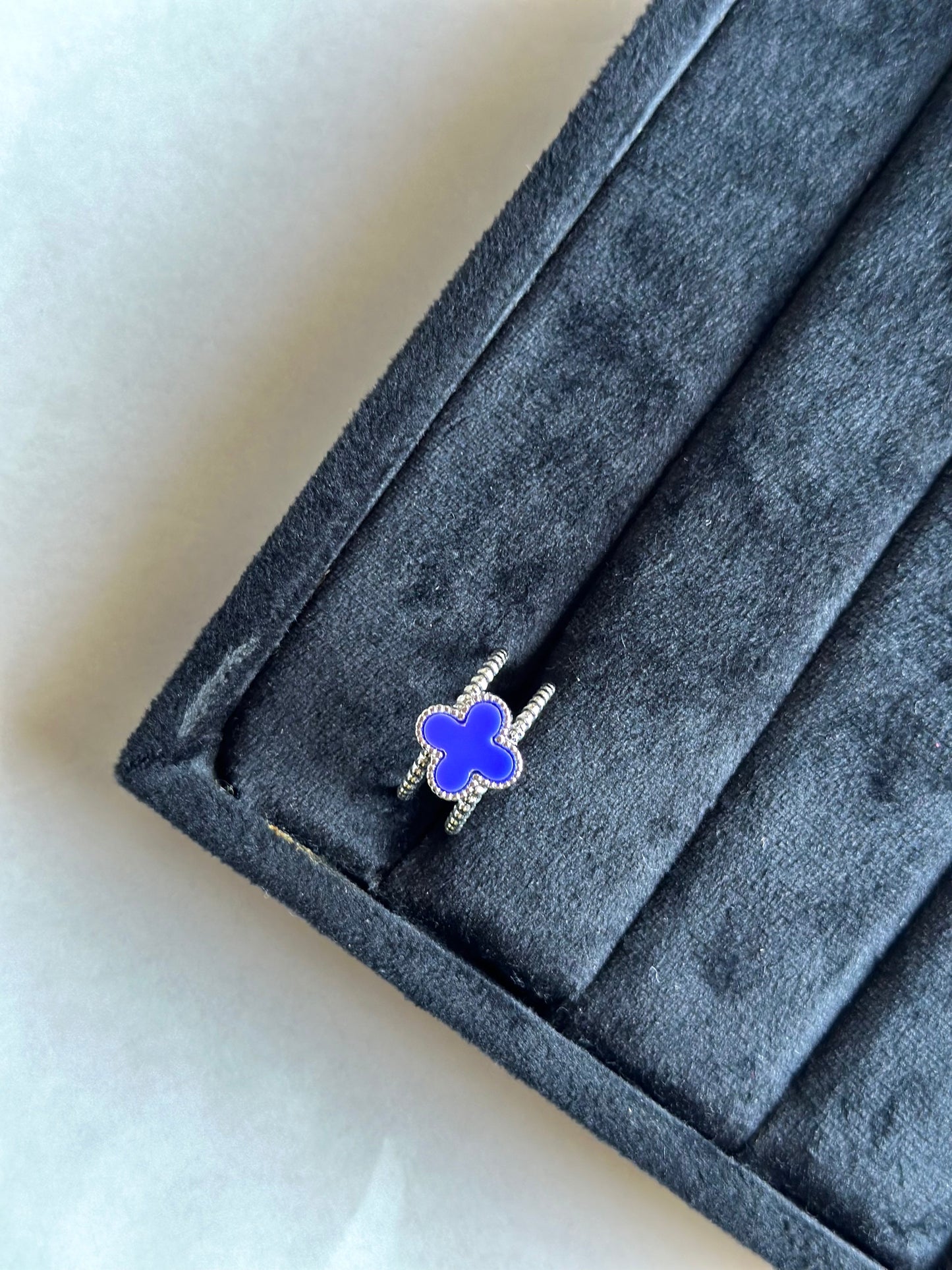 Silver colored vancleef ring