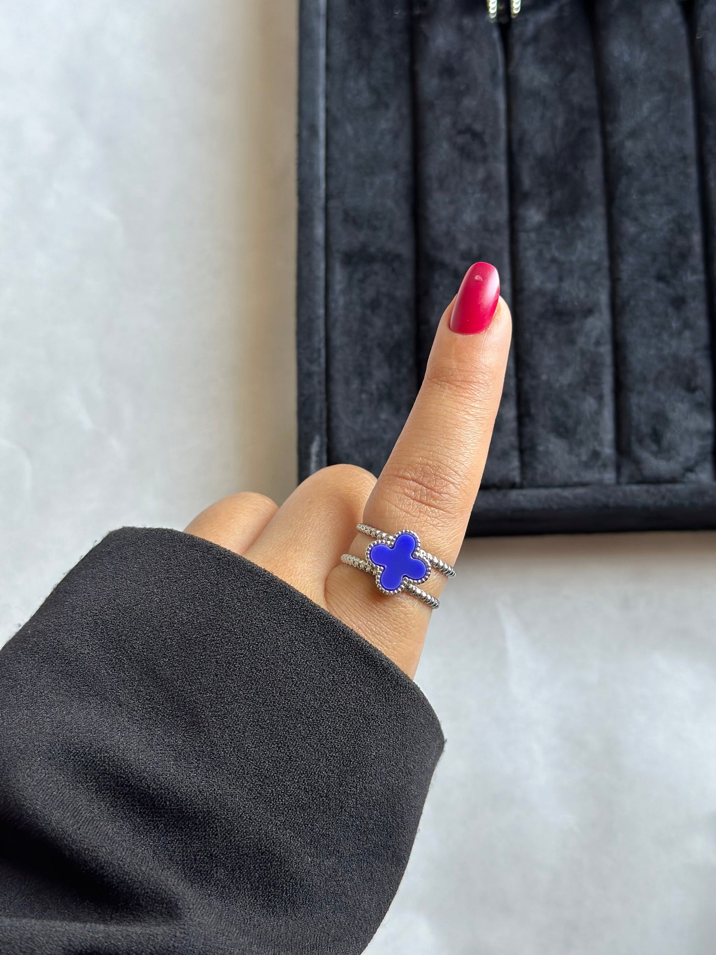 Silver colored vancleef ring