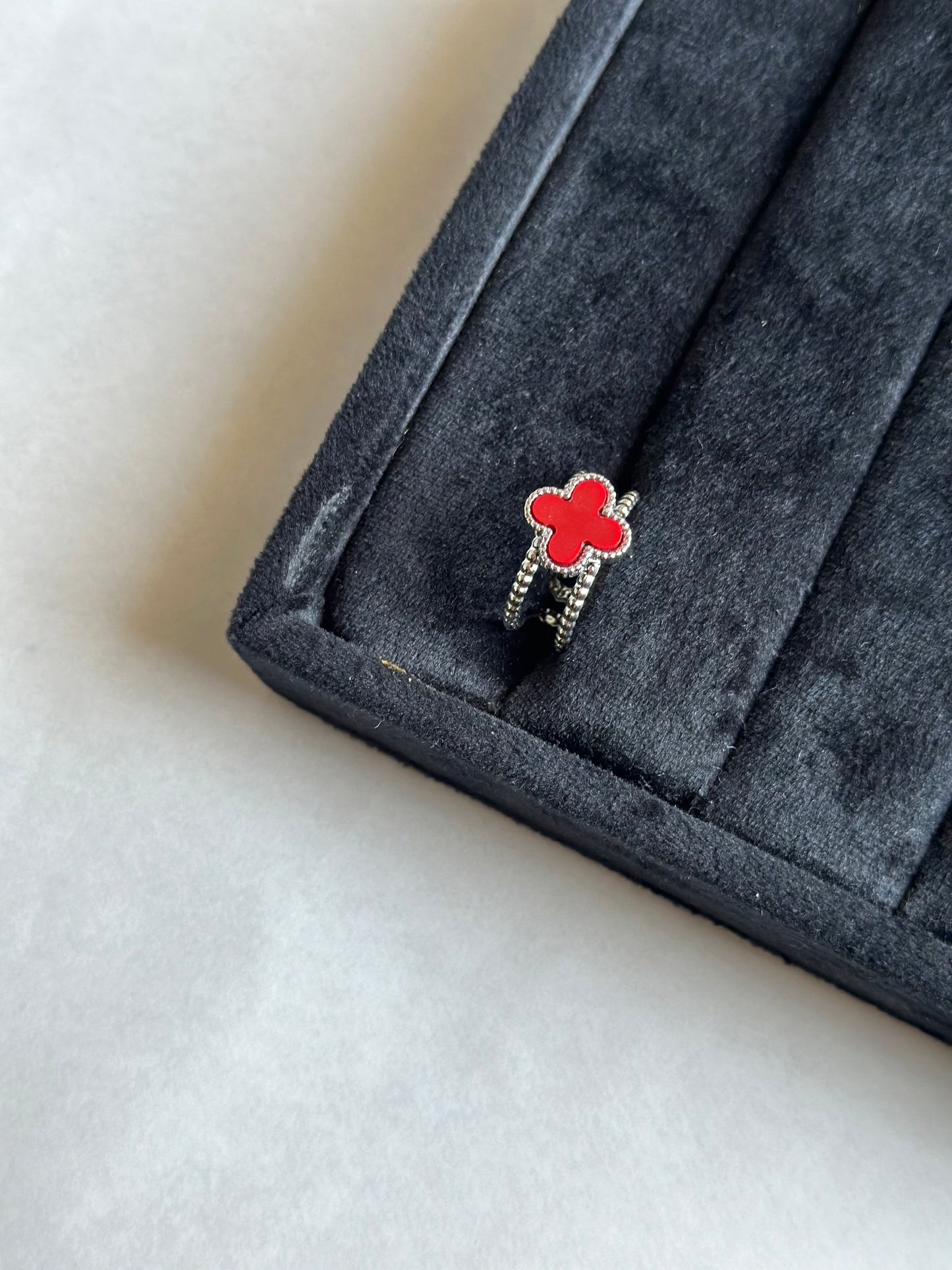 Silver colored vancleef ring